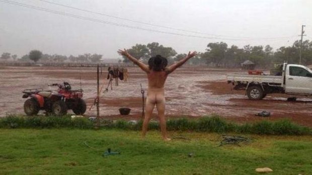 Cobar farmer James Rogers celebrating the arrival of rain.