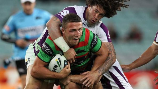 Power play: Sam Burgess is halted by Kevin Proctor.