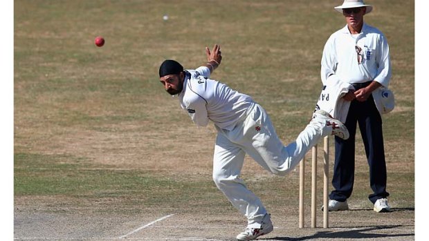 High hopes: Monty Panesar bowls during the tour match between Sussex and Australia.