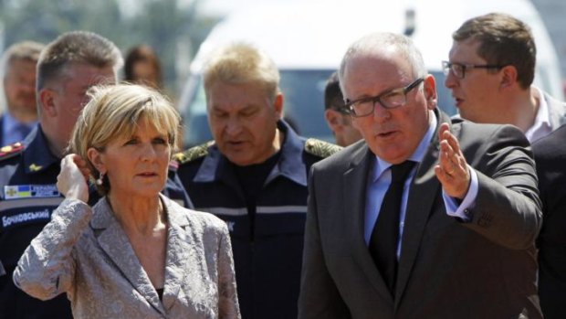 Dutch Foreign Minister Frans Timmermans (right) shows the way to his Australian counterpart Julie Bishop during their visit to Kharkiv airport.