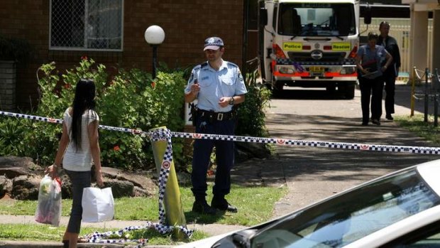 Police inspect the Canley Vale apartment block after Rasa was stabbed and her daughter killed.
