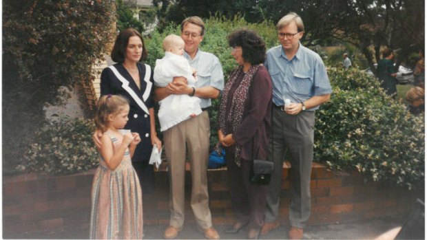 Lives entwined: Swan, his wife Kim and daughter Libbi, with Kevin Rudd and his wife Therese at the baptism of Swan's son Matt in 1995 - Rudd was godfather.