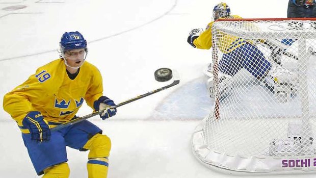Positive test: Sweden forward Nicklas Backstrom watches a shot fly past during the semi-final against Finland.