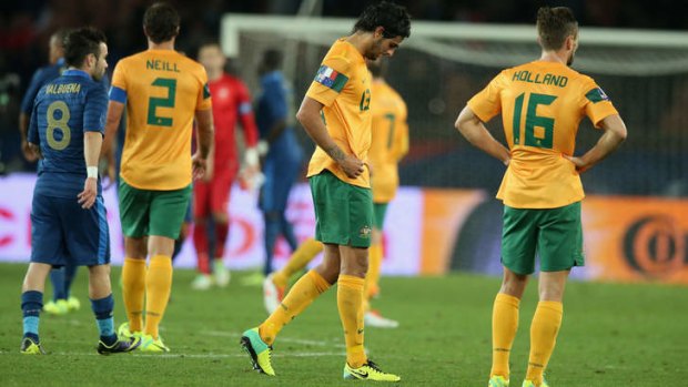 Embarrassing: the Socceroos look dejected during the weekend's 6-0 loss to France in Paris.