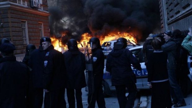 Bosnian policemen outside a local government building in the Bosnian capital.