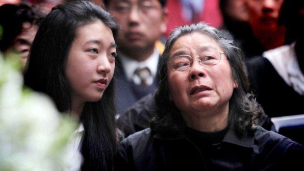 Brenda Lin and Zh Feng-Qin Lin at the Lin family funeral.
