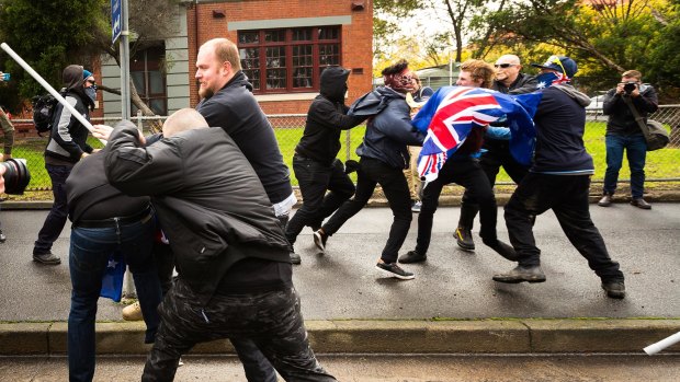 Protesters from rival anti-racism and anti-Islam groups clash in Coburg in May.