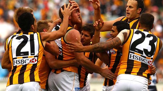 Hawk highlight: Jarryd Roughead, being congratulated by teammates, is making his mark as a flexible and generous powerhouse.