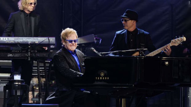 Feeling ill ... Sir Elton John onstage in Saint-Laurent-sur-Sevre, western France, on July 3.