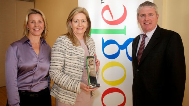 Google Australia's Clare Hatton and Minister for Small Business Brendan O'Connor present City of Perth Lord Mayor Lisa Scaffidi (centre) with the inaugural Google eTown Award.