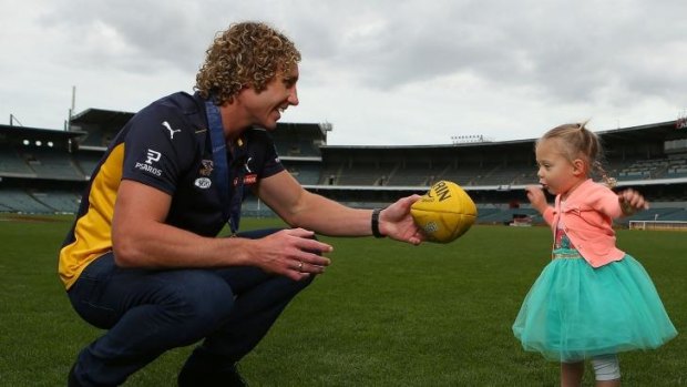 Matt Priddis, seen here with daughter Nala, is a Brownlow medallist but not eligible to represent Australia against Ireland.