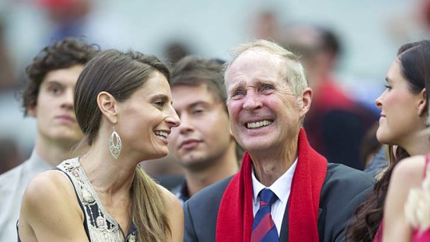 Jim Stynes' widow, Samantha, reaches out to his father, Brian.