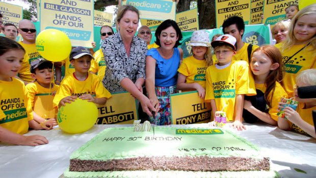 Griffith's Labor candidate Terri Butler and opposition health spokeswoman Catherine King cut a birthday cake to celebrate Medicare's 30th anniversary.