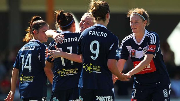 Melbourne Victory players celebrate a goal by Caitlin Friend during the W-League match against the Newcastle Jets on Saturday.