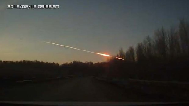 Flames shoot across the sky after at least one meteor hit the ground.