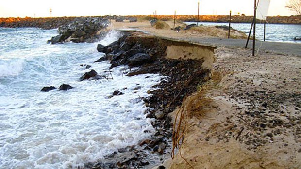 A 2009 photo of waves undermining the Kingscliff breakwall.