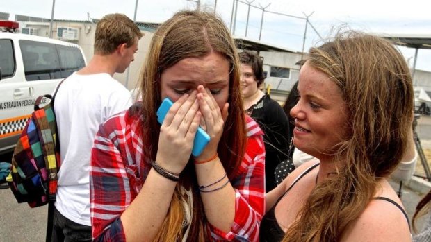 Overcome with emotion: 5SOS fan Eloise Price weeps after a glimpse of the band arriving in Sydney.