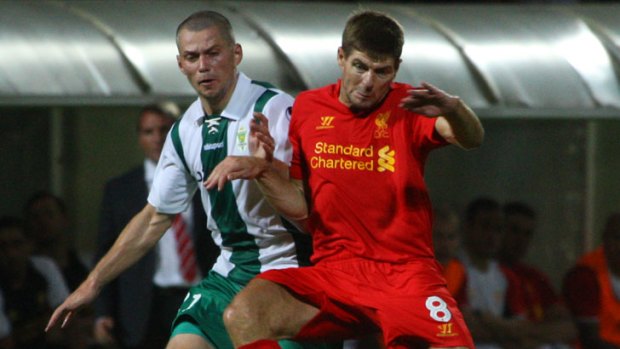 Liverpool's Steven Gerrard (right) vies for the ball with Gomel's Artur Liatvinski during their Europa League qualifying clash in Gomel, Belarus.