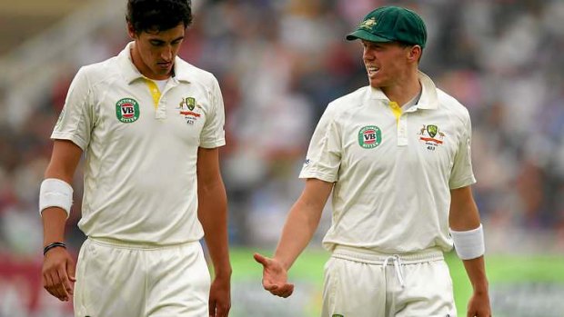 Helpful advice: Peter Siddle of Australia talks to Ashes debutant Mitchell Starc.