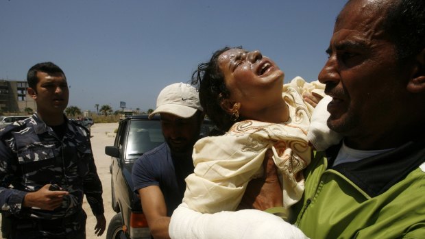 
A Syrian child evacuated on Friday from a fire in a  compound housing Syrian refugees in the southern city of Sidon. 