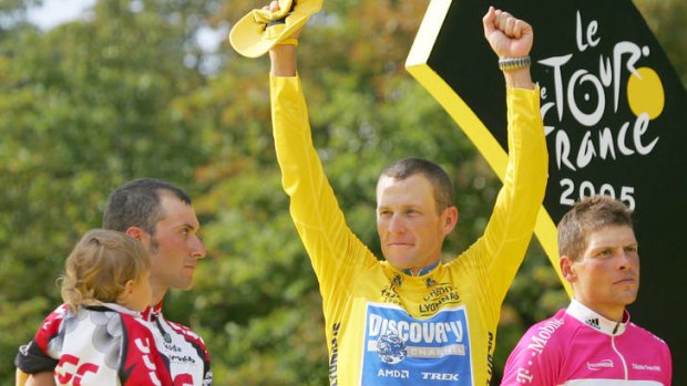 In 2005 ... Lance Armstrong gestures from the podium after winning his seventh straight Tour de France cycling race, as second-placed Ivan Basso of Italy, left, and third-placed Jan Ullrich of Germany, look on.