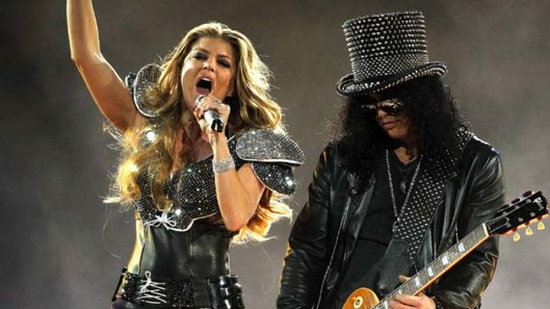 Fergie of the Black Eyed Peas performs with Slash during the Halftime Show at Cowboys Stadium.