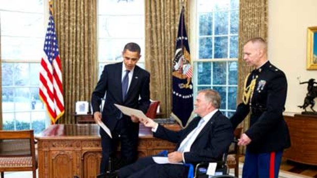 A wheelchair-bound Kim Beazley presents his diplomatic credentials to US President Barack Obama.
