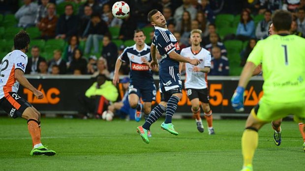 Kosta Barbarouses heads towards goal during the match between Victory and Brisbane Roar.