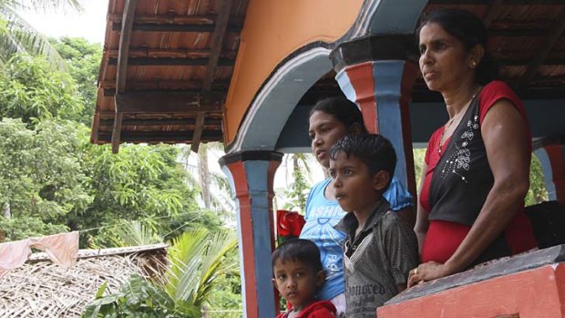 "He was on the floor, they were kicking and punching him’’   ...  above, the family of Sumith and Indika Balapuwaduge. The brothers have been in jail for two years with a trial yet to take place.