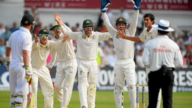 Incredulous: Umpire Aleem Dar is unmoved as the Australians stand mid-pitch after Stuart Broad edged a catch to Michael Clarke at slip.