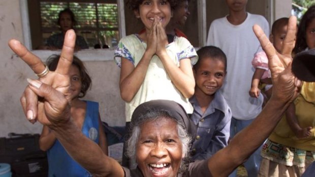 A hopeful start: 63-year-old refugee Ana Mariana Do Rego gives her ecsatatic reaction to the result of East Timor's referendum in 1999.