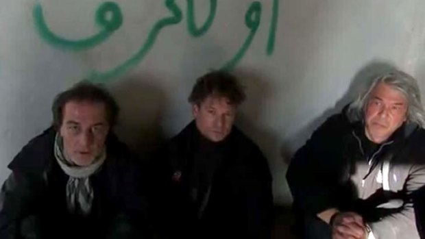 An image grab taken from a video uploaded on YouTube allegedly shows Richard Engel, centre, during his detention.