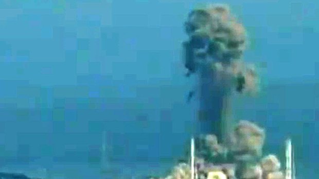 A screen grab from local news footage shows the blast at the Fukushima nuclear power station.