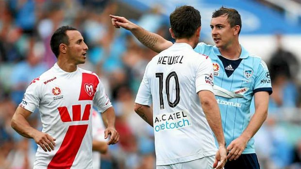 Mouthing off: The once quiet Seb Ryall of Sydney FC gives Harry Kewell a mouthful after the Heart star badly missed a penalty last weekend.