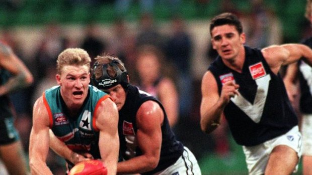 Nathan Buckley being tackled by Nathan Burke while playing for the Allies in 1996.