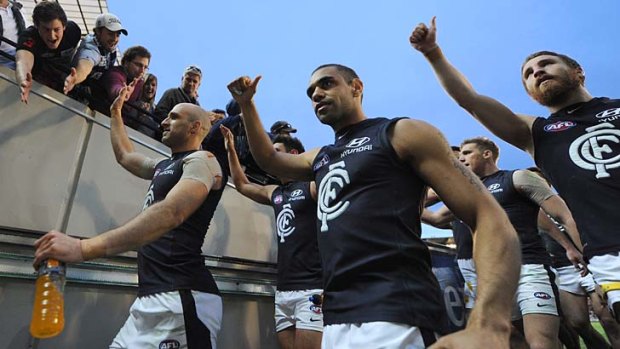 Carlton's Chris Judd, Chris Yarran and Zach Tuohy leave the ground after beating Richmond at the MCG.