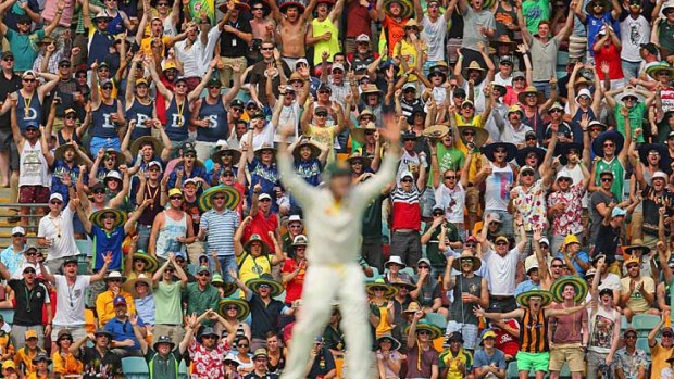 The crowd cheers the Australians on during the Gabba Test.