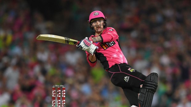 Nic Maddinson hits a six for the Sydney Sixers.
