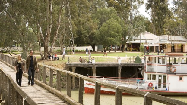 Couple walking across the Murray River at Pioneer Settlement in Swan Hill, The Murray