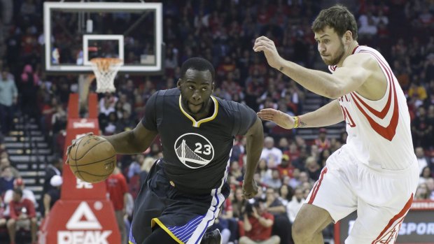Big improver: Golden State Warriors forward Draymond Green drives the ball past Rockets rookie Donatas Motiejunas in Houston.
