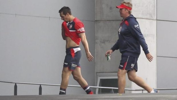 Stand by their man: Trent Robinson (R) with Mitchell Pearce at Roosters training earlier this week. 
