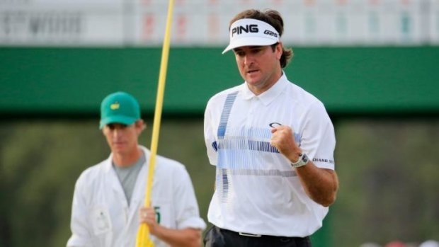 Bubba Watson celebrates on the 18th green after winning the 2014 Masters Tournament.
