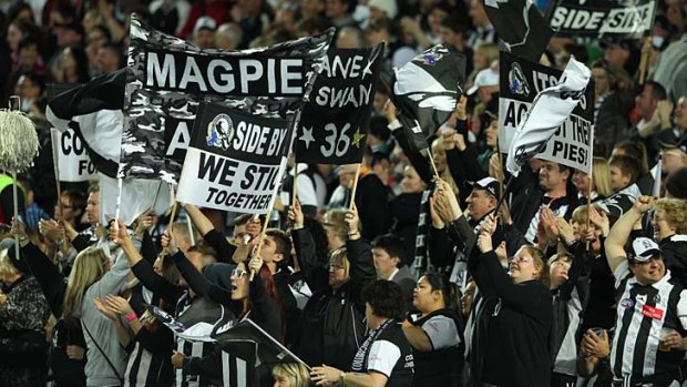 Collingwood fans cheer their team on against Sydney on the weekend.