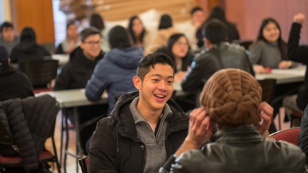 Brandon Hung makes the most of his four minutes at a Melbourne University speed friending event.