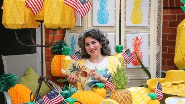 Canberra Australian American Association President Alicia Doherty prepares for her pineapple-themed experience at the National Multicultural Festival.