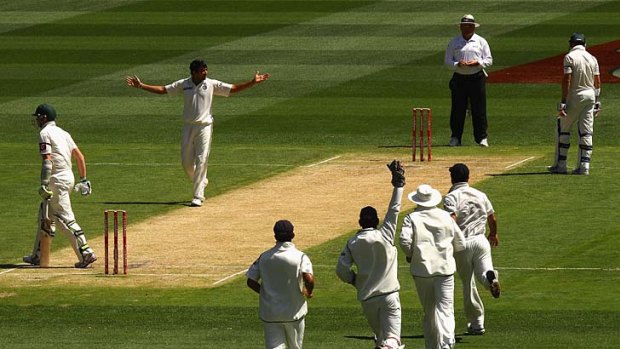 Indian quick Zaheer Khan of India takes the wicket of Peter Siddle.