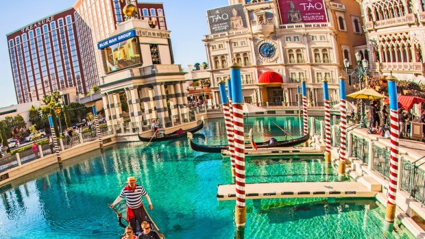 People enjoy the gondola at Venetian Resort Hotel & Casino in Las Vegas.