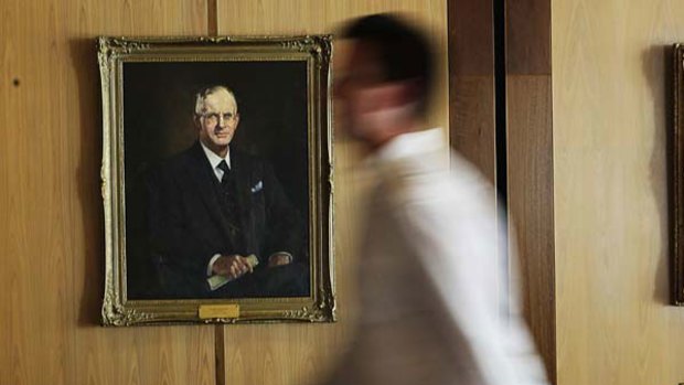 Wartime prime minister John Curtin's Parliament House portrait is safe for now, but longer term its position over the national mantelpiece is under threat.