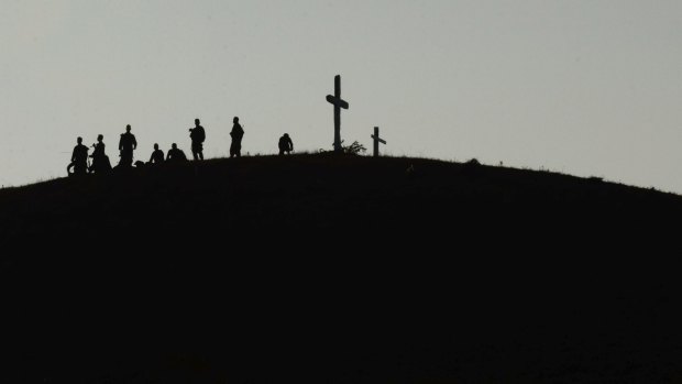 Philippine troops stand guard on a hill at daybreak in Crow Valley, Tarlac province, Philippines during the 11-day "Balikatan" annual joint military exercises.
