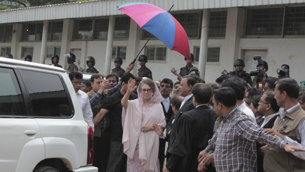 Khaleda Zia surrounded by supporters outside the court in Dhaka on Sunday.